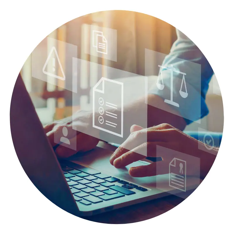 Person typing on laptop with digital icons overlay.
